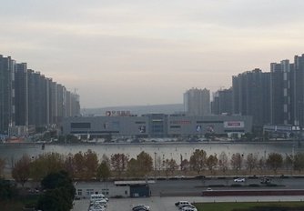 Photo: A residential project under construction and soon-to-open Quanshun shopping plaza