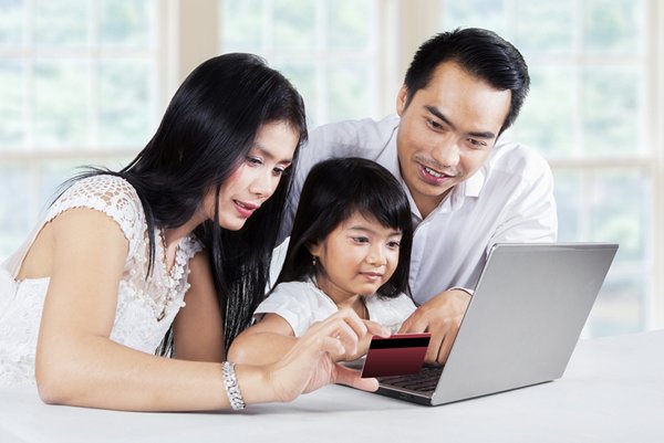 Photo: Shopping Online: a Parent-child Activity