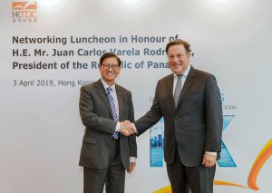 Raymond Yip (left) greets Panama’s President Juan Carlos Varela Rodriguez