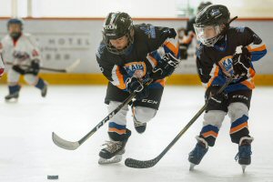 Players try out a synthetic ice field