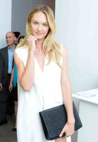 Candice Swanepoel wearing the Jessica clutch from BOTTLETOP